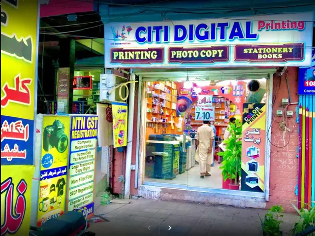Earlier Citi Digital shopfront with Printing and Photo Copy signboards and orange shelves inside