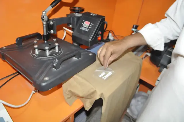 Heat press machine for T-shirt printing in the shop